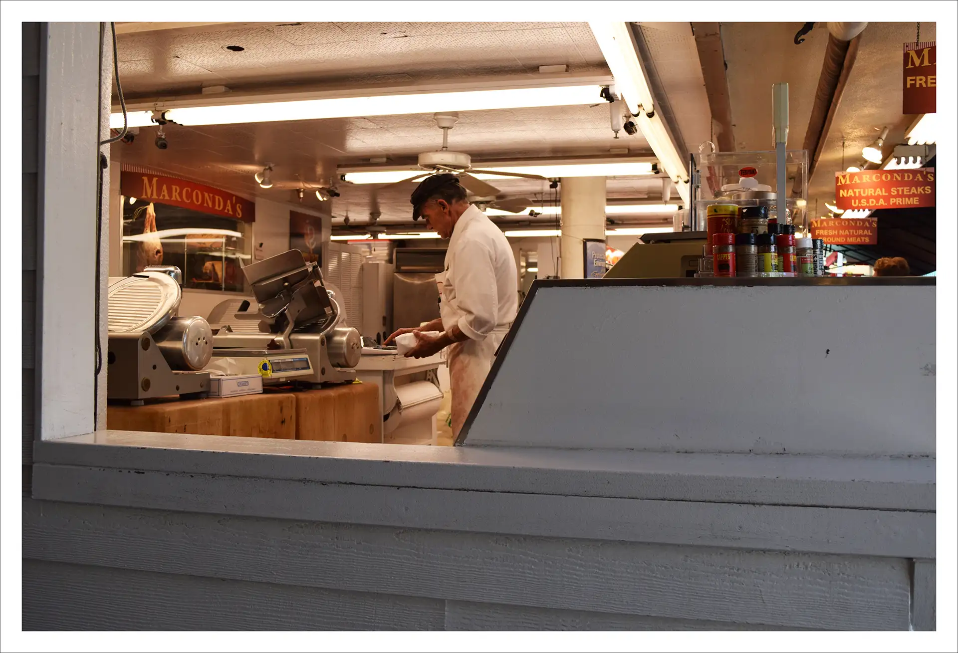 Los Angeles, man working a machine in a restaurant
