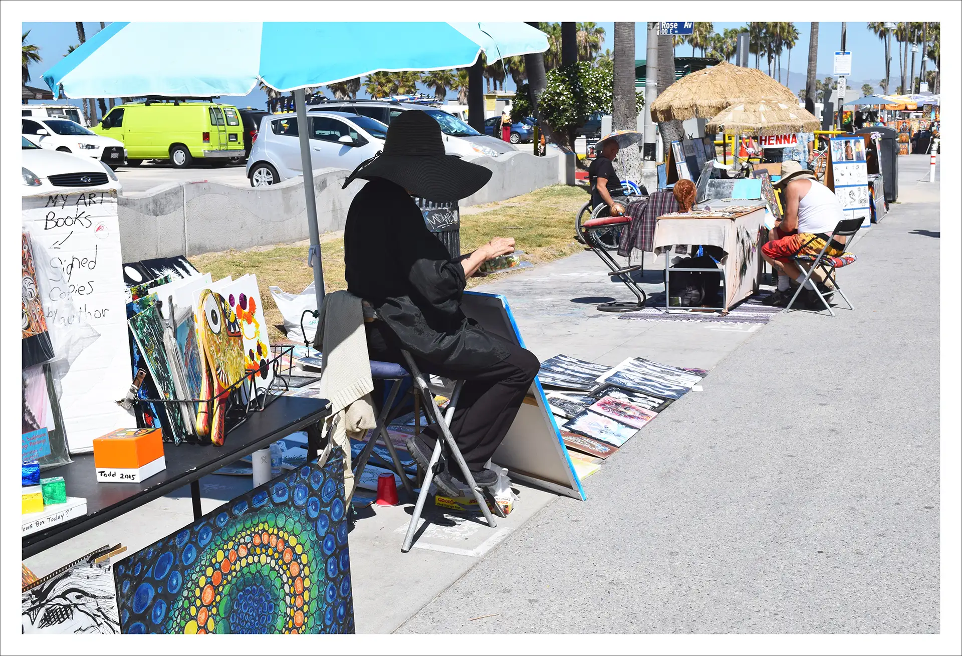 Los Angeles, woman in black painting, sunny